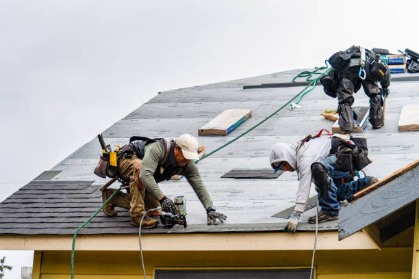 Professional Gutter Installation technician working in Booneville, MS